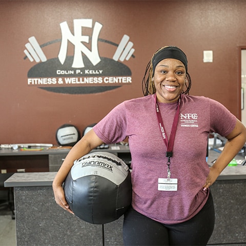 Photo of woman working out in NFC fitness center